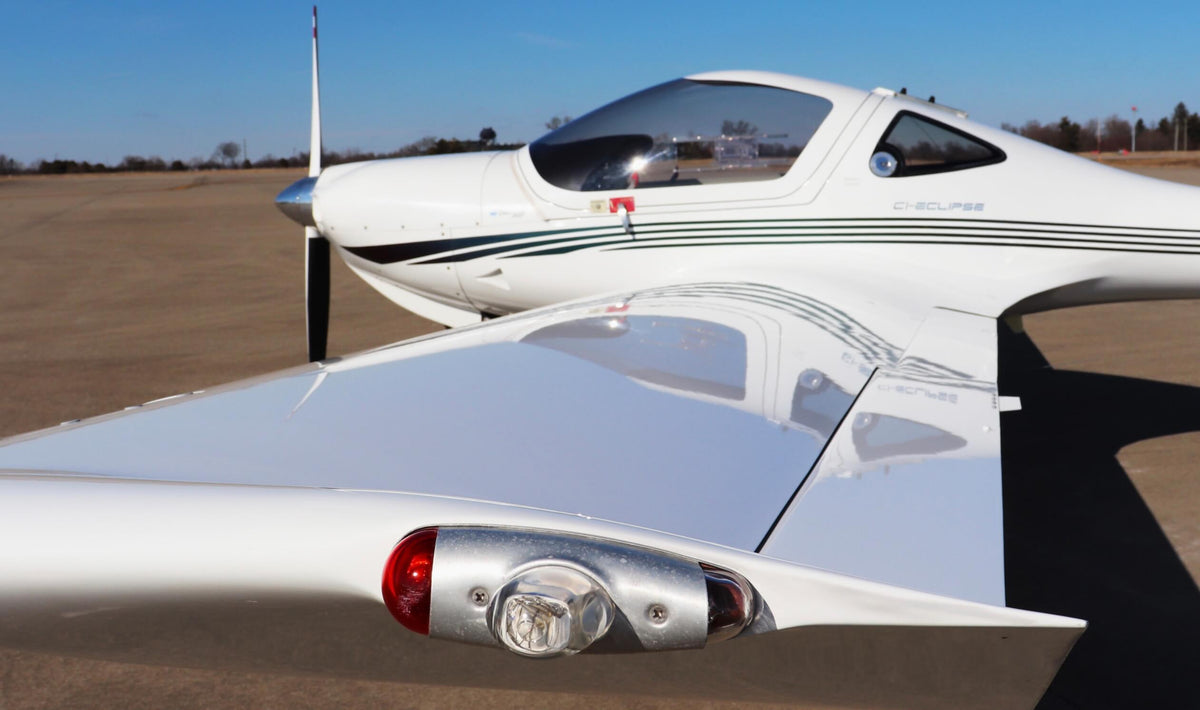 The nose, spinner and wing of a Diamond DA20 on the ramp at Van Nuys Airport