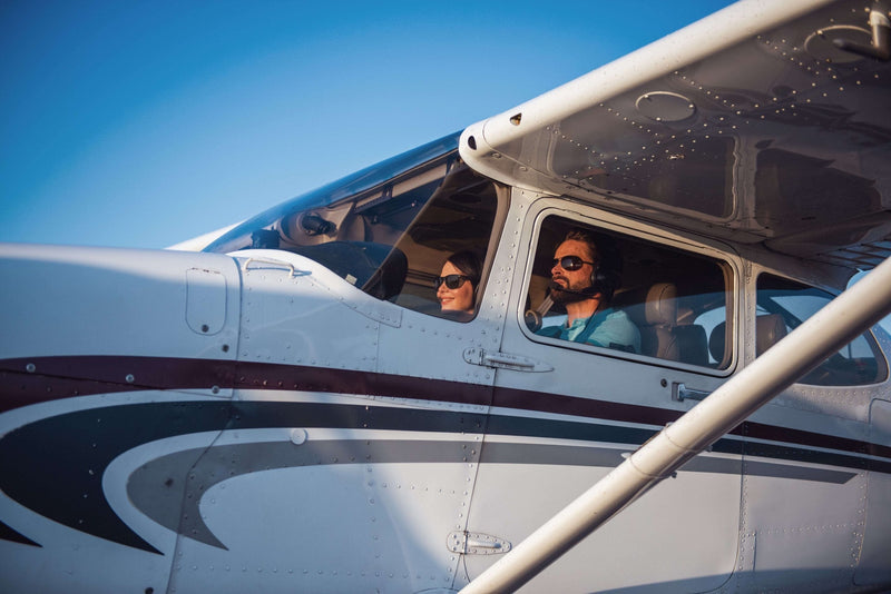 Flight instructor briefing a student at a table before a multi-engine checkride at LA Flight School in Van Nuys