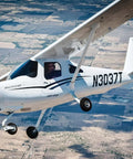 Student at the controls of a training aircraft during a discovery flight over Los Angeles with Los Angeles Flight School