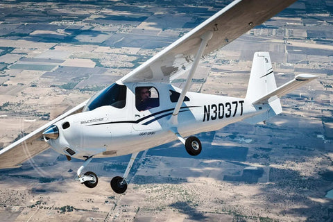 Student at the controls of a training aircraft during a discovery flight over Los Angeles with Los Angeles Flight School