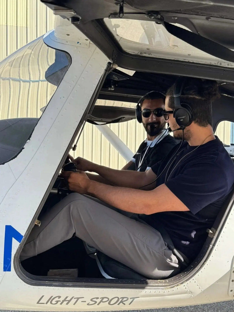 A flight instructor and student in the cockpit of a Cessna 162 Skycatcher on a discovery flight