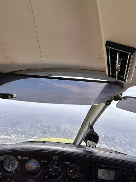 The view through the windshield on climb out during an instrument lesson