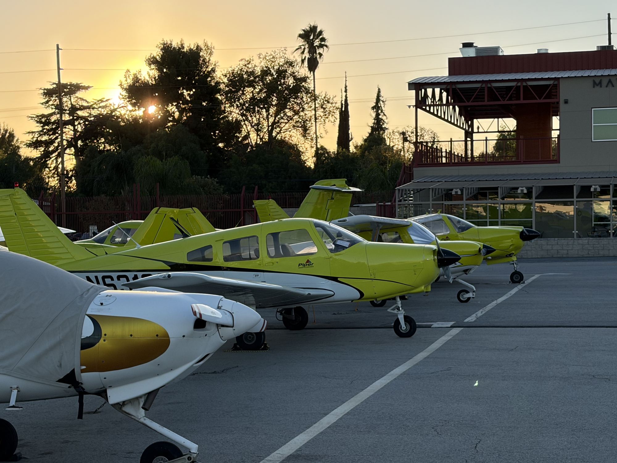 The Los Angeles Flight School training fleet lined up on the ramp at Van Nuys Airport (KVNY)