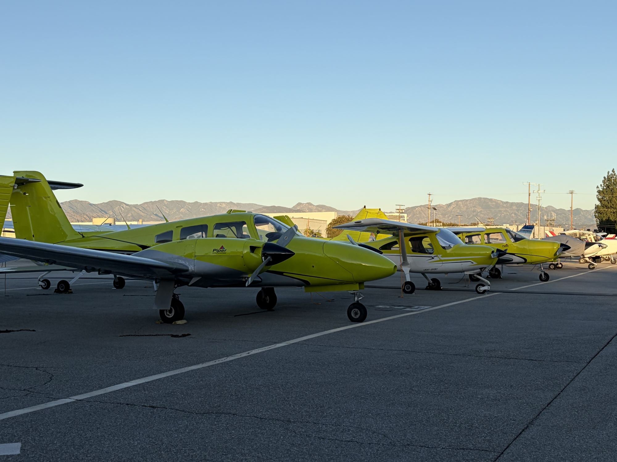 Piper Warrior four-seat training aircraft parked on the ramp at Van Nuys Airport